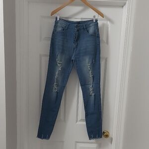 Women's Blue Distressed Jeans. Size L.